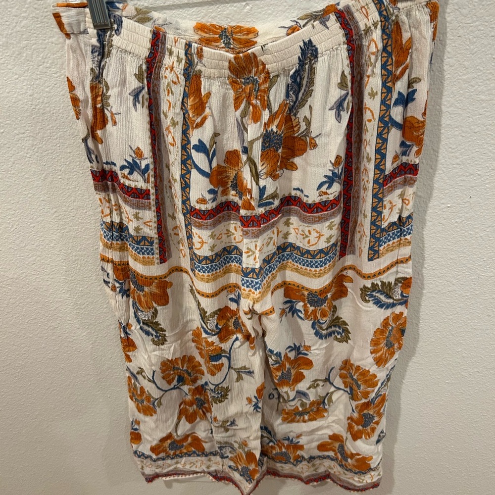 Patrons of Peace White and Orange Bermudas Vibrant Floral Geometric Design